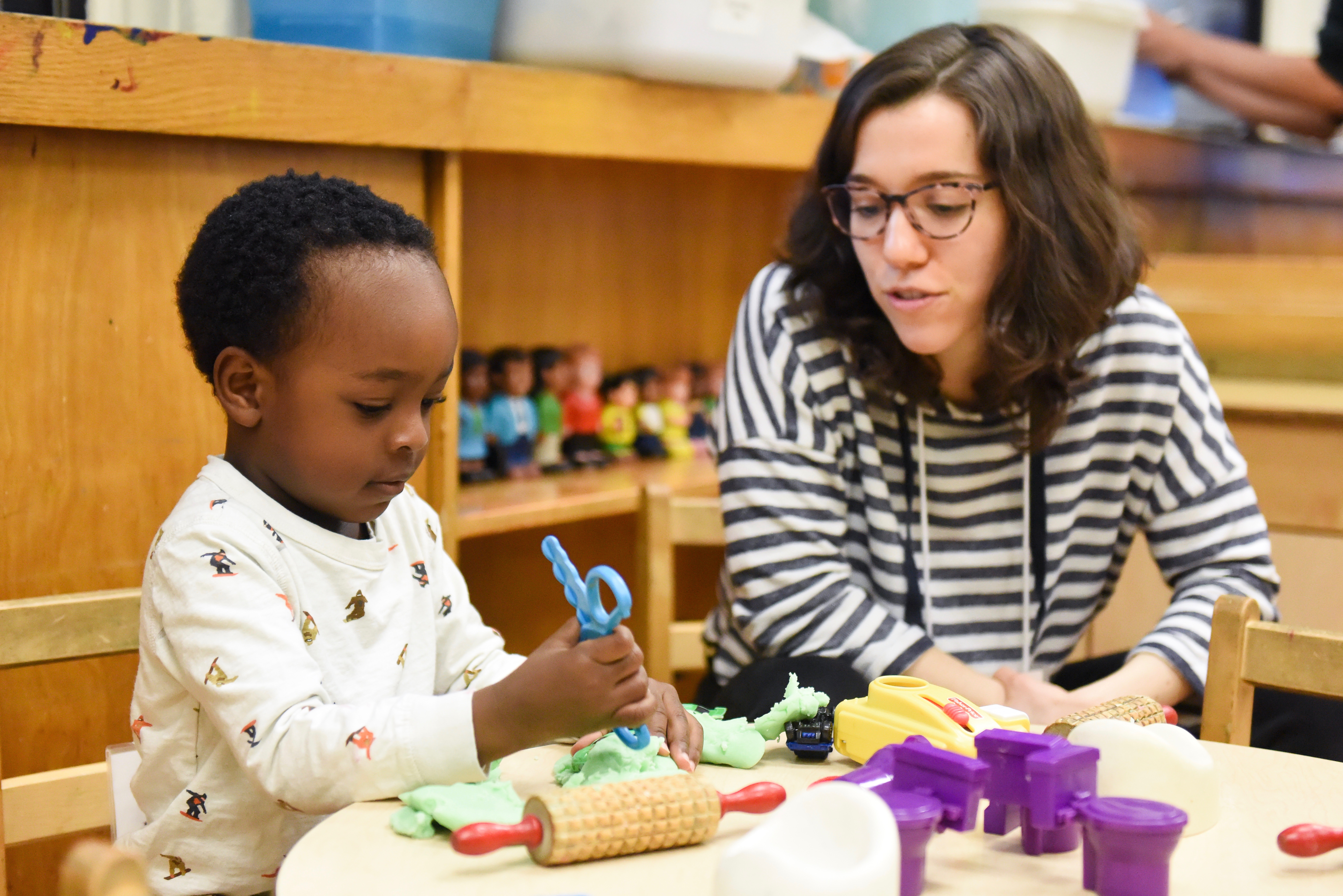 Teacher with Boy at Table